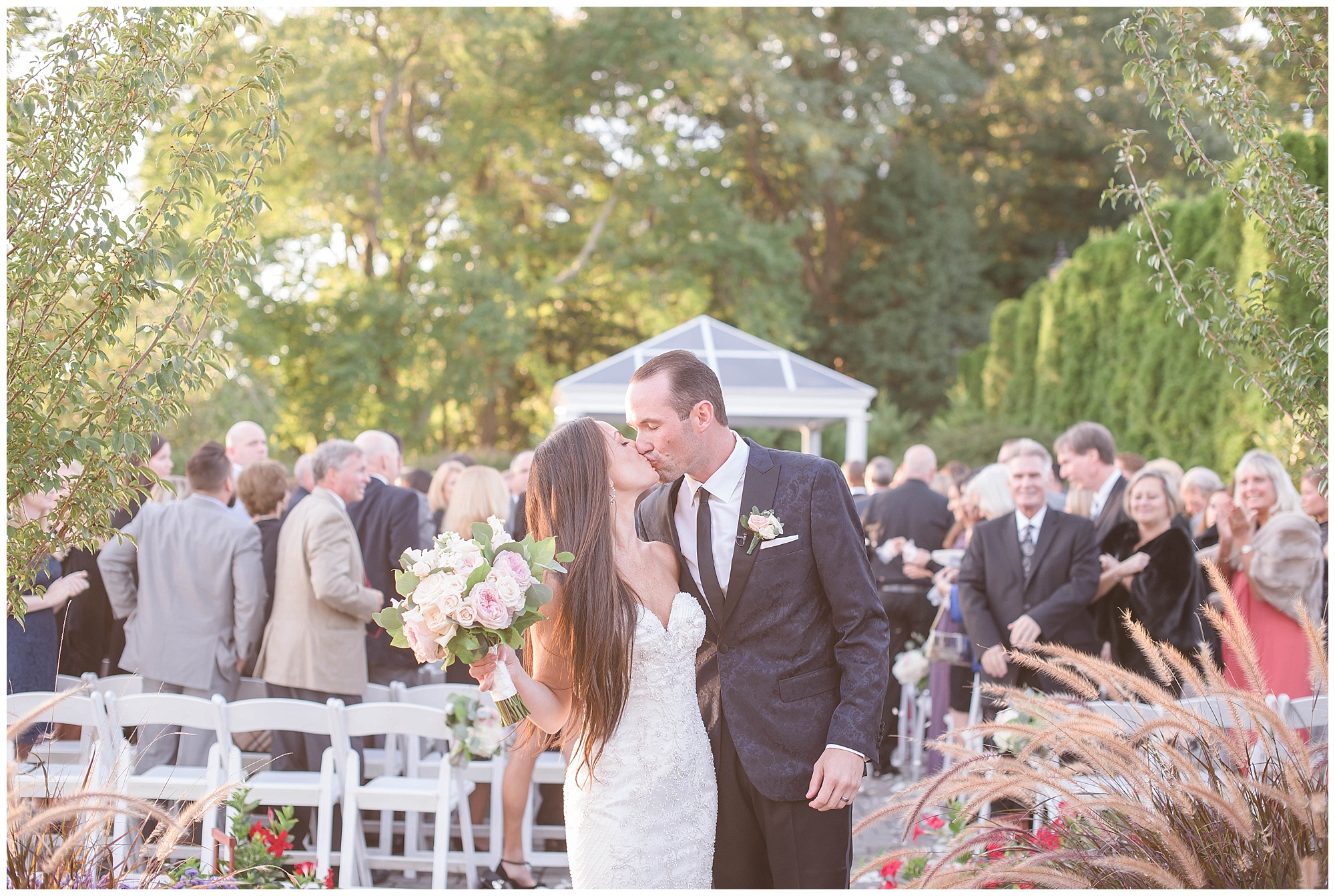 bride and groom kiss