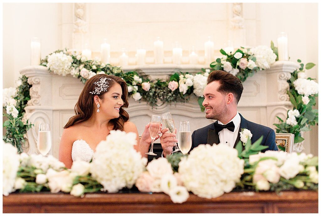 bride and groom at sweet heart table