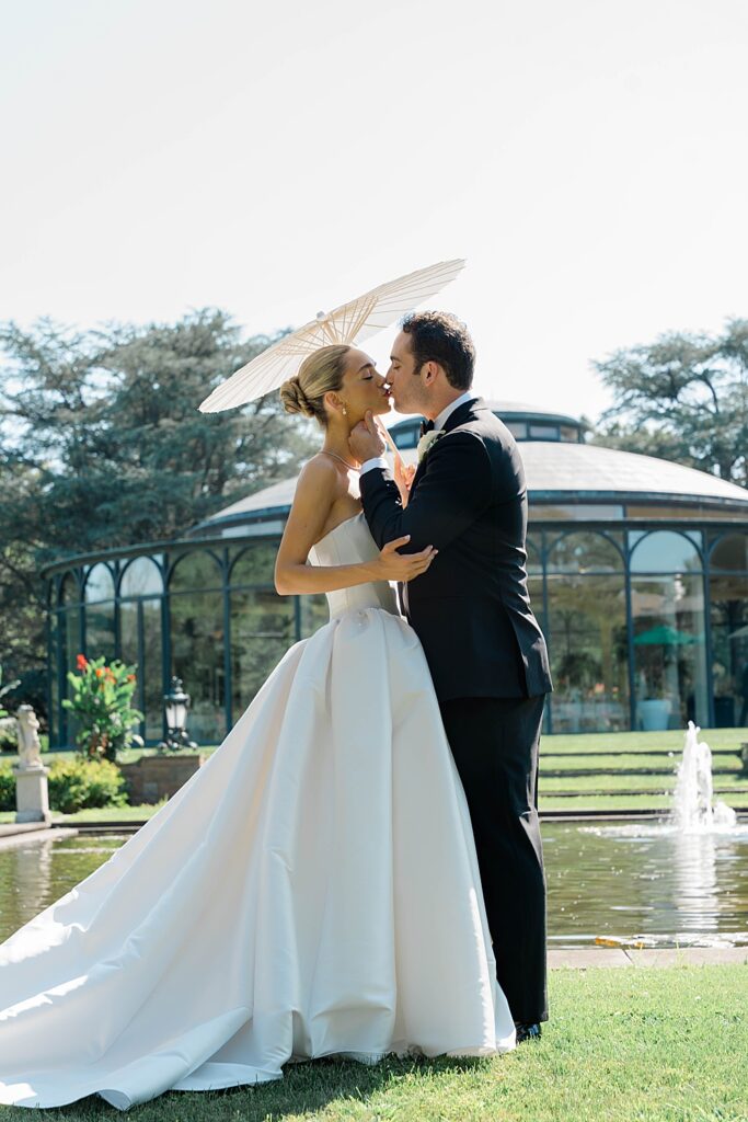 bride and groom with parasol