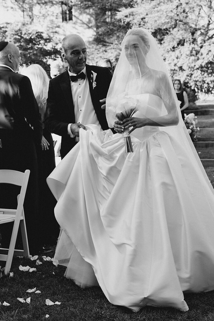 bride's dad walks her down the aisle