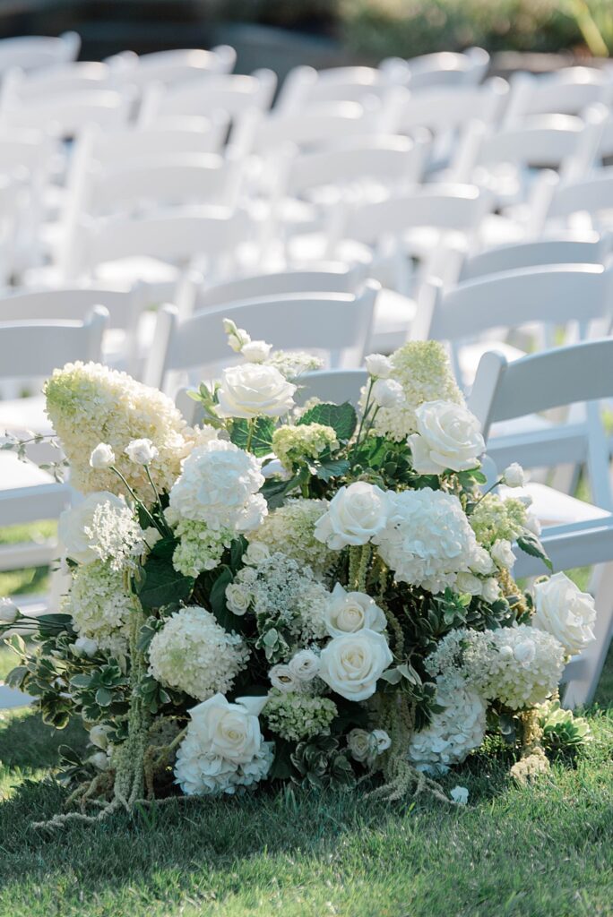 white and greenery ceremony florals